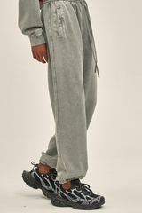 Wax-dyed, distressed, loose-fitting sweatpants