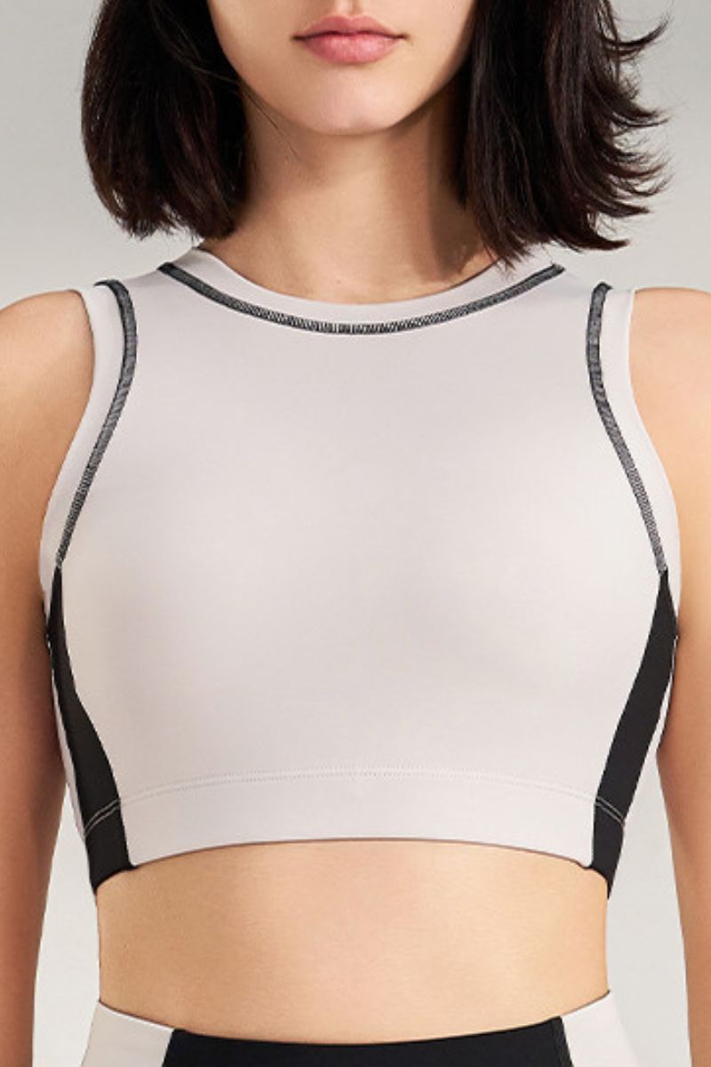 Women's color-blocked sleeveless sports bra.