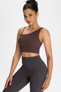 Bra with built-in chest padding and slanted shoulders