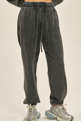 Wax-dyed, distressed, loose-fitting sweatpants