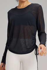 Women's side-seamed drawstring waist long-sleeved shirt.