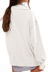 Loose-fitting, flared-neck hoodie with a split design