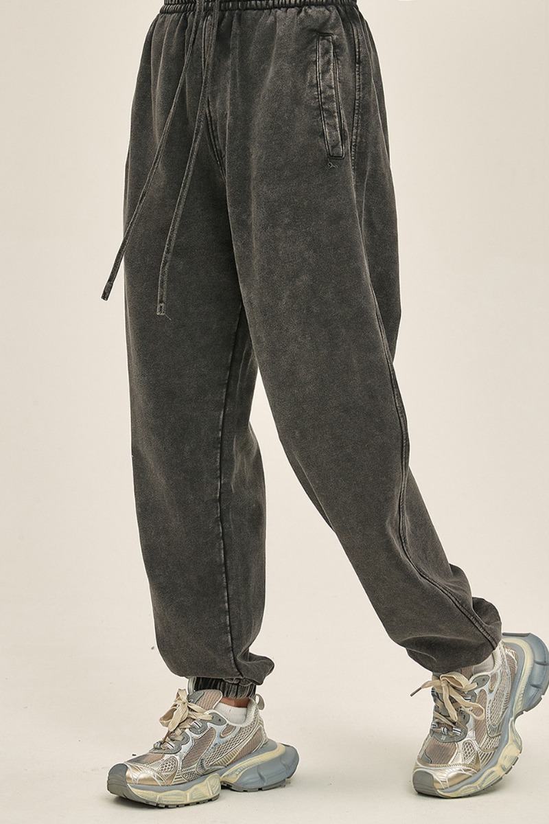 Wax-dyed, distressed, loose-fitting sweatpants