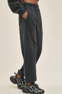 Wax-dyed, distressed, loose-fitting sweatpants