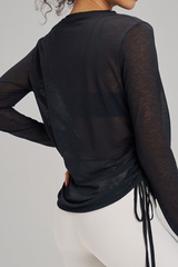 Women's side-seamed drawstring waist long-sleeved shirt.