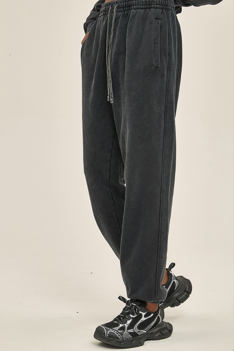 Wax-dyed, distressed, loose-fitting sweatpants