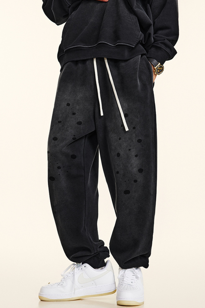Men's vintage spray paint cuffed sweatpants.
