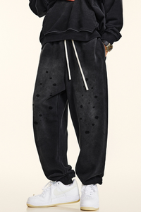 Men's vintage spray paint cuffed sweatpants.