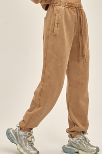 Wax-dyed, distressed, loose-fitting sweatpants