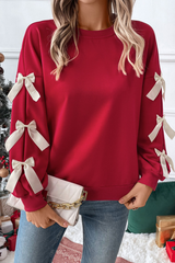 Round-necked, bow-style, red Christmas-themed sweatshirt