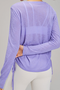 Women's side-seamed drawstring waist long-sleeved shirt.