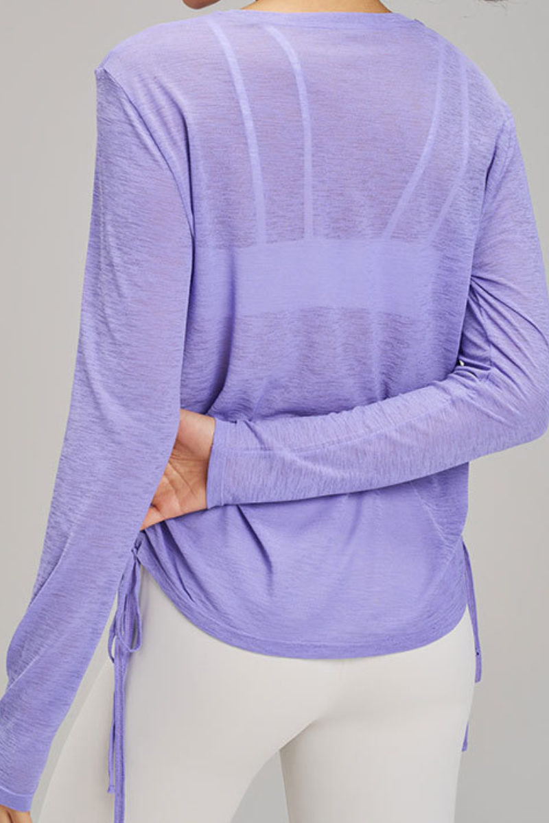 Women's side-seamed drawstring waist long-sleeved shirt.