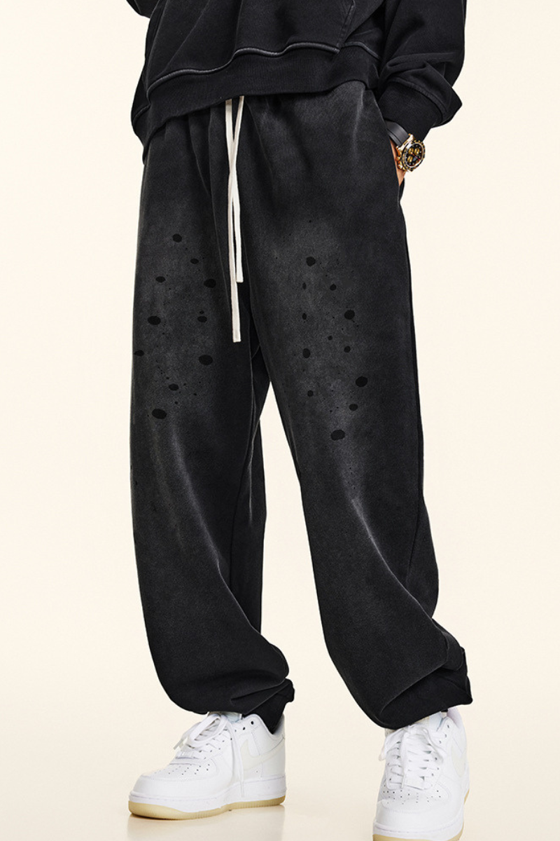 Men's vintage spray paint cuffed sweatpants.