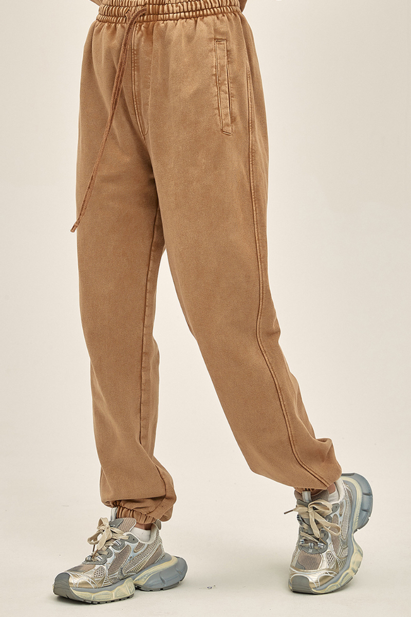 Wax-dyed, distressed, loose-fitting sweatpants
