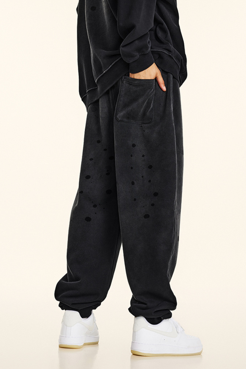 Men's vintage spray paint cuffed sweatpants.