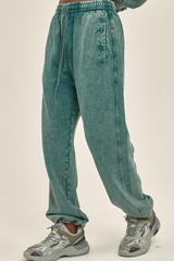 Wax-dyed, distressed, loose-fitting sweatpants