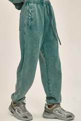 Wax-dyed, distressed, loose-fitting sweatpants