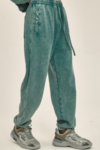 Wax-dyed, distressed, loose-fitting sweatpants