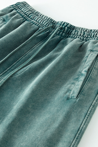 Wax-dyed, distressed, loose-fitting sweatpants