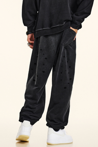 Men's vintage spray paint cuffed sweatpants.