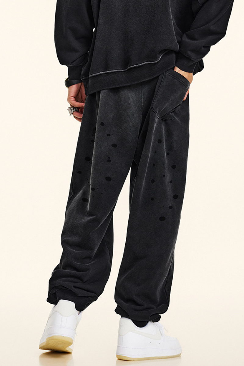 Men's vintage spray paint cuffed sweatpants.