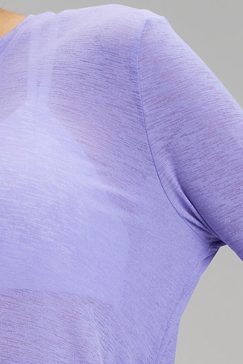 Women's side-seamed drawstring waist long-sleeved shirt.