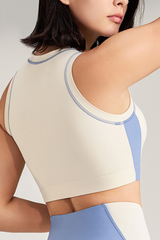 Women's color-blocked sleeveless sports bra.