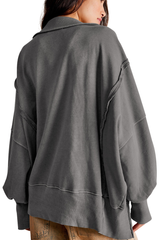 Loose-fitting, flared-neck hoodie with a split design