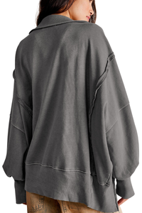 Loose-fitting, flared-neck hoodie with a split design