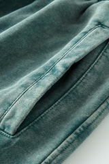 Wax-dyed, distressed, loose-fitting sweatpants