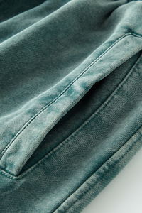 Wax-dyed, distressed, loose-fitting sweatpants