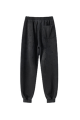 Men's vintage spray paint cuffed sweatpants.
