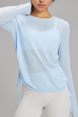 Women's side-seamed drawstring waist long-sleeved shirt.