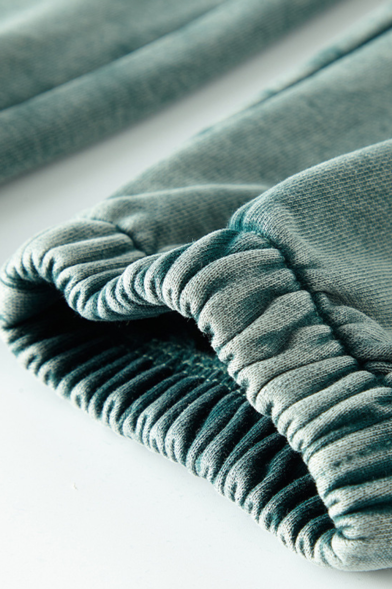 Wax-dyed, distressed, loose-fitting sweatpants