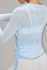 Women's side-seamed drawstring waist long-sleeved shirt.